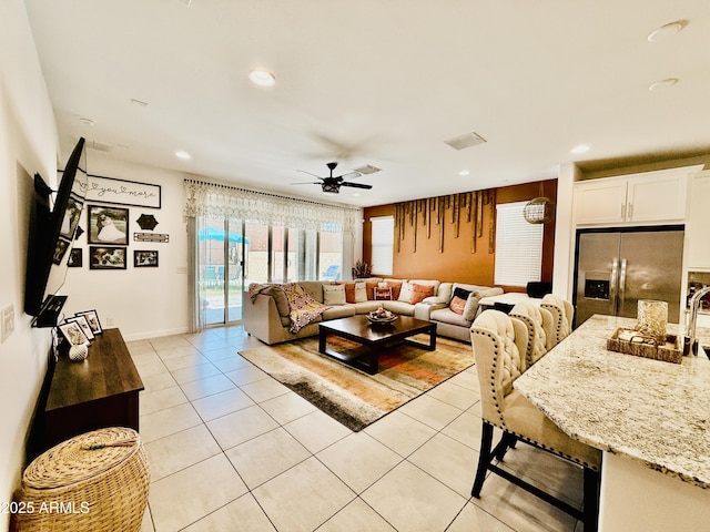 1657 W Monte Way, Phoenix, AZ 85041 - living room featuring light tile patterned flooring, a ceiling fan, and recessed lighting