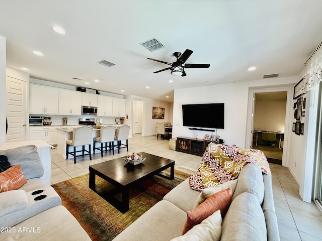 1657 W Monte Way, Phoenix, AZ 85041 - living room with light tile patterned flooring, recessed lighting, and a ceiling fan