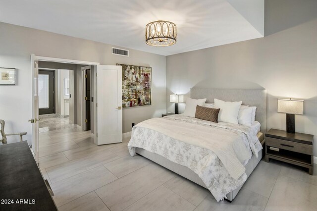 bedroom featuring a chandelier