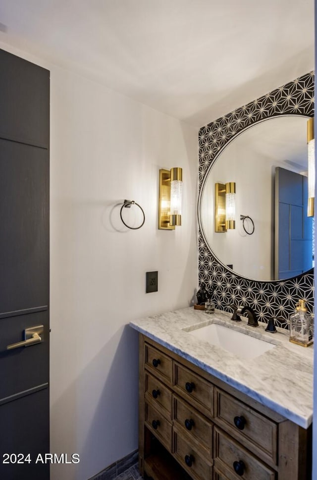 bathroom featuring tasteful backsplash and vanity