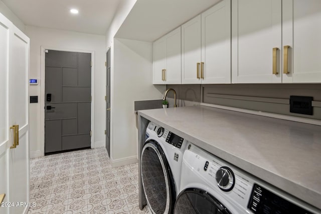 laundry area featuring cabinets and independent washer and dryer