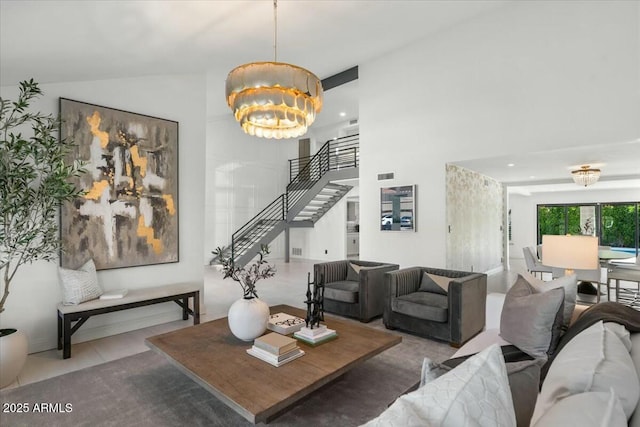 living room with high vaulted ceiling and a chandelier