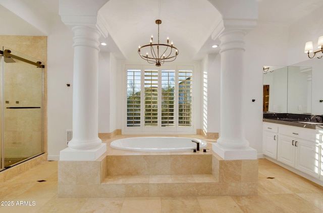 full bath featuring a bath, a notable chandelier, ornate columns, and tiled shower