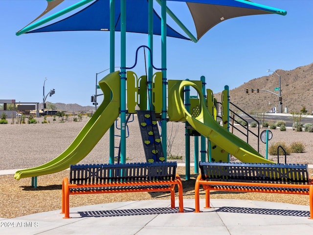 view of playground featuring a mountain view