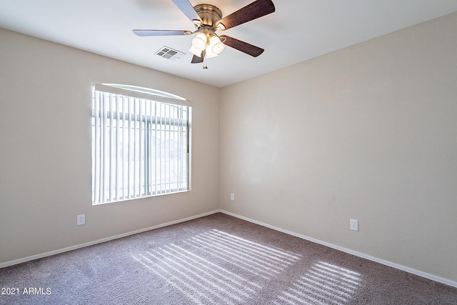 unfurnished room featuring carpet and ceiling fan