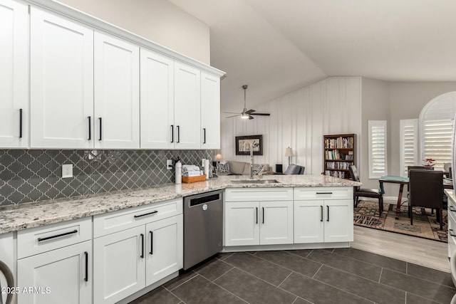 kitchen with dark tile patterned floors, dishwasher, white cabinetry, vaulted ceiling, and ceiling fan