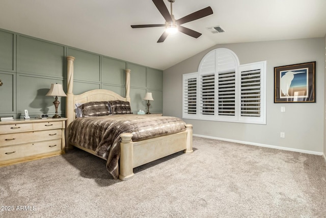 carpeted bedroom with ceiling fan and lofted ceiling