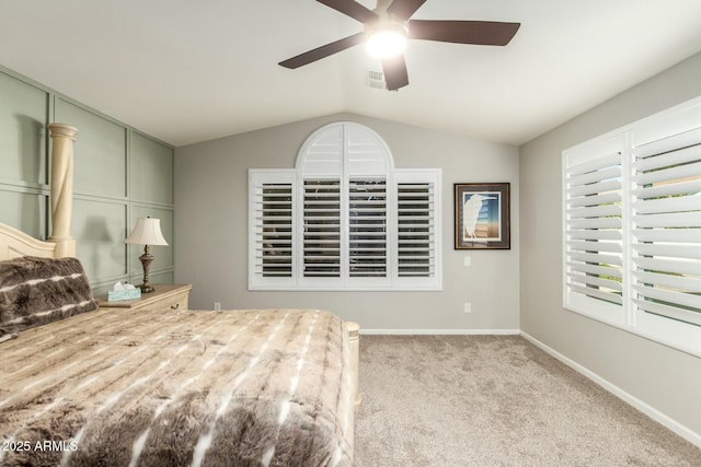 bedroom featuring ceiling fan, light carpet, and vaulted ceiling