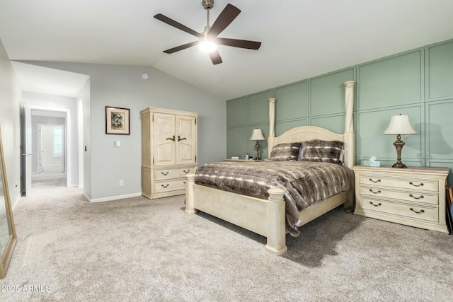 carpeted bedroom featuring ceiling fan and vaulted ceiling