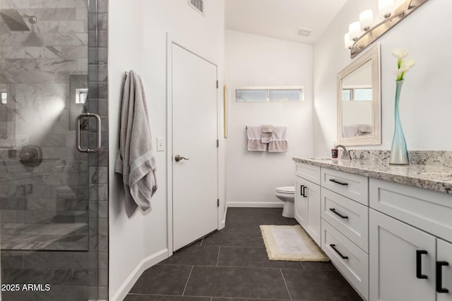 bathroom with toilet, tile patterned floors, a shower with shower door, and vanity