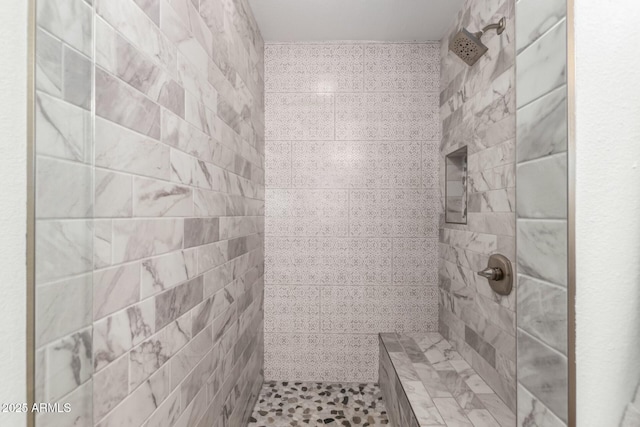 bathroom featuring tiled shower