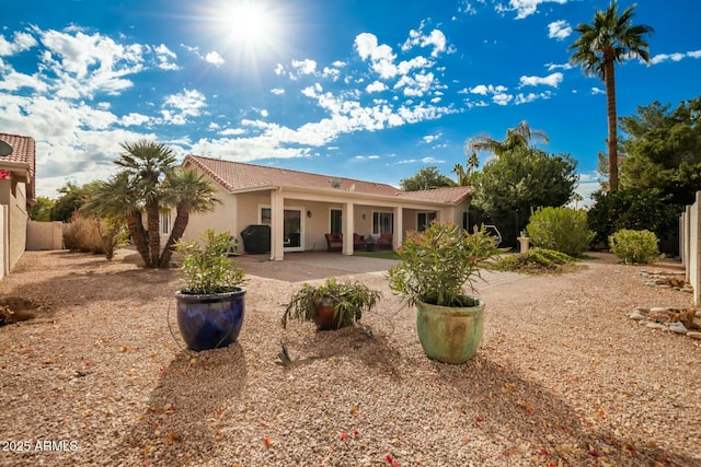 back of property featuring a patio area