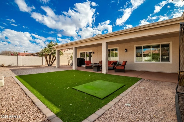 rear view of house featuring a patio area and an outdoor hangout area