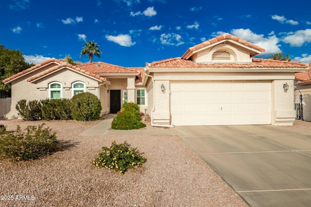 mediterranean / spanish-style house featuring a garage