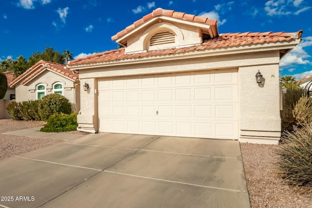 mediterranean / spanish house featuring a garage