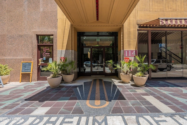 view of exterior entry featuring french doors