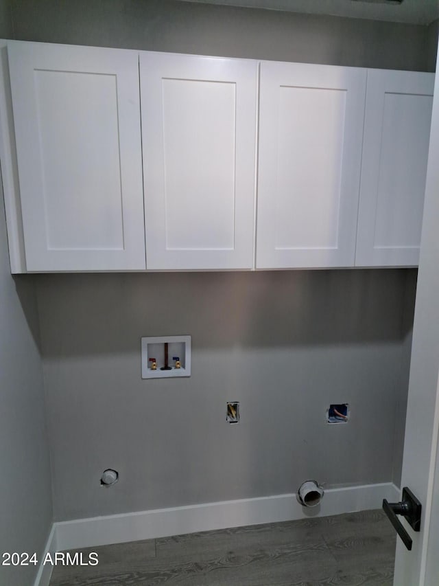 washroom with cabinets and washer hookup