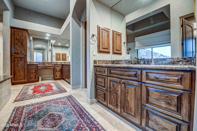 bathroom featuring vanity and tile flooring