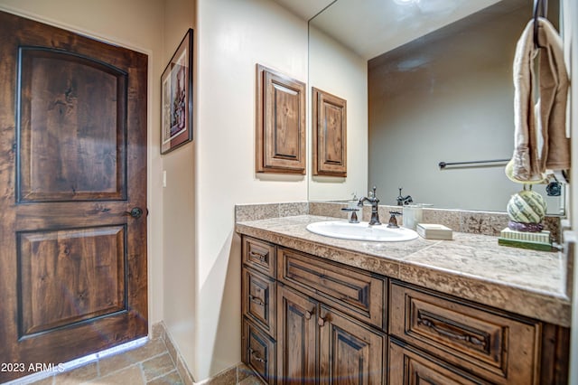 bathroom featuring tile floors and vanity