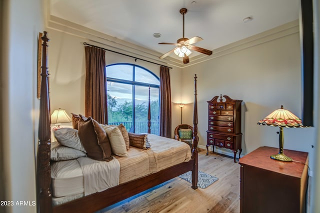 bedroom with ceiling fan and light hardwood / wood-style flooring