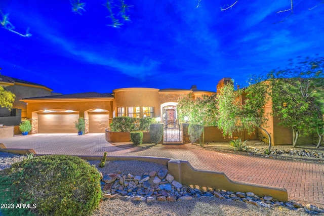 view of front of property with a garage