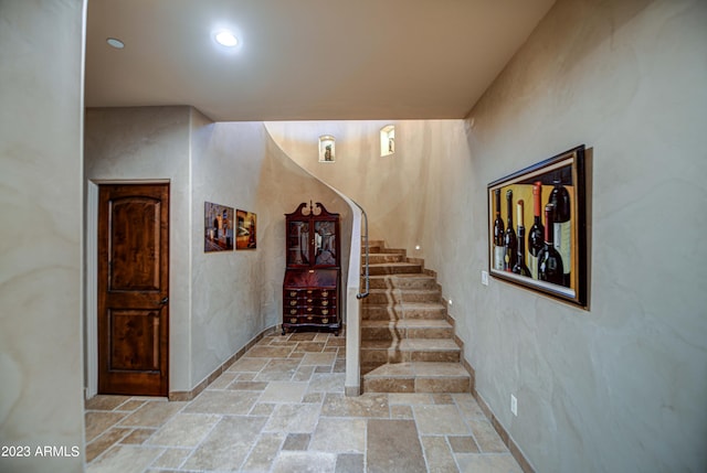 stairs featuring light tile floors