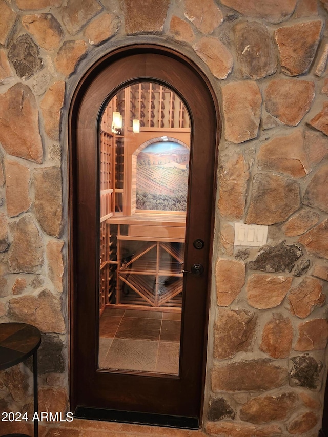 wine room with tile flooring