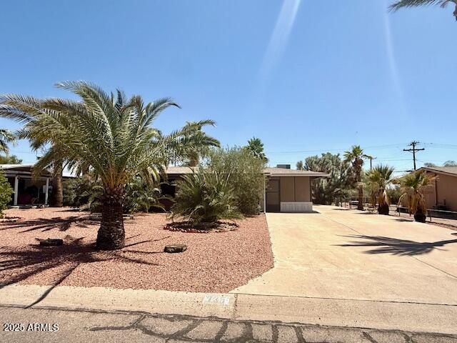 735 E Desert Ave, Apache Junction, AZ 85119 - obstructed view of property featuring driveway