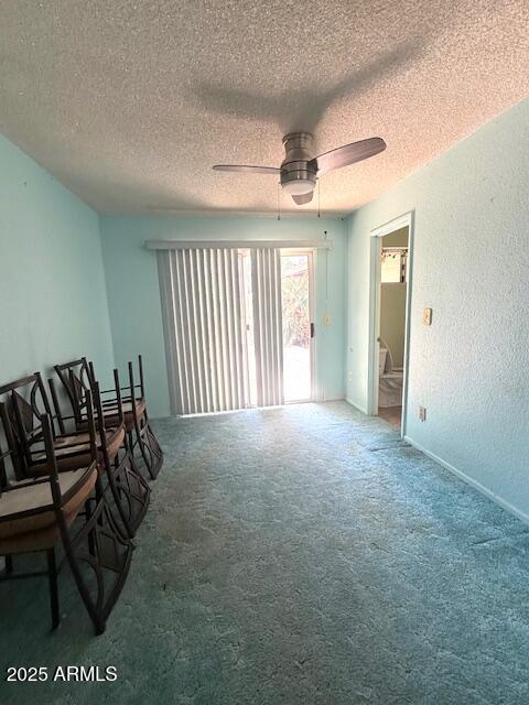 735 E Desert Ave, Apache Junction, AZ 85119 - living room featuring carpet flooring, a ceiling fan, and a textured ceiling