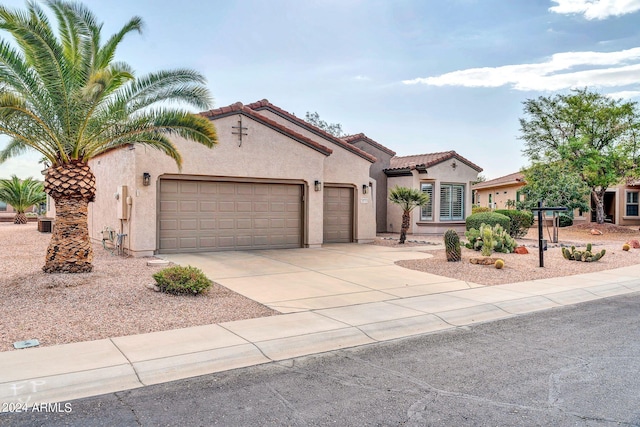 mediterranean / spanish-style home featuring a garage