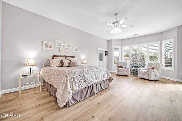 bedroom with ceiling fan and light hardwood / wood-style flooring