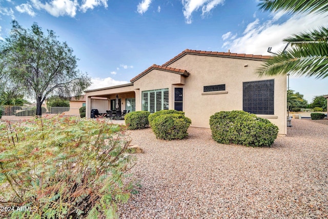 back of property featuring a patio area