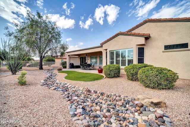 rear view of house with a patio area