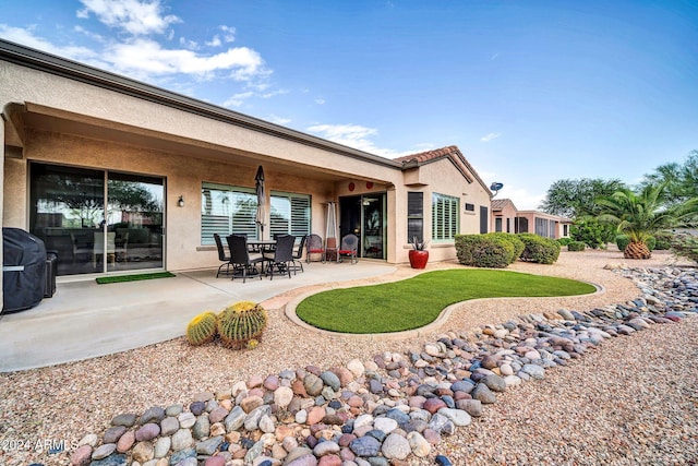 rear view of house with a patio area