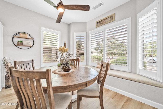 dining space featuring light hardwood / wood-style floors and ceiling fan