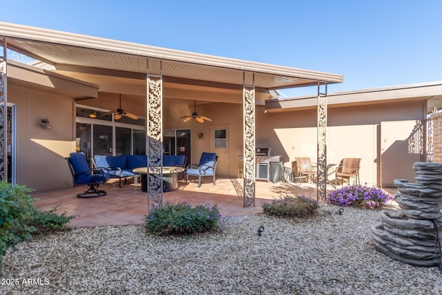 back of house with ceiling fan, outdoor lounge area, and a patio area