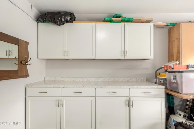 kitchen featuring white cabinets