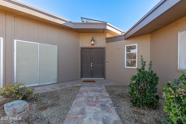 doorway to property with a patio area