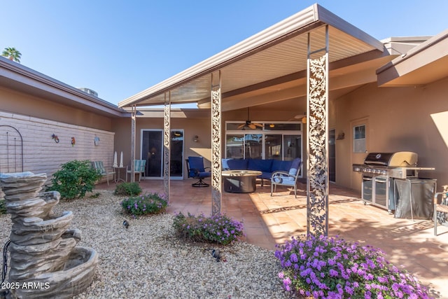 rear view of house featuring a patio and ceiling fan