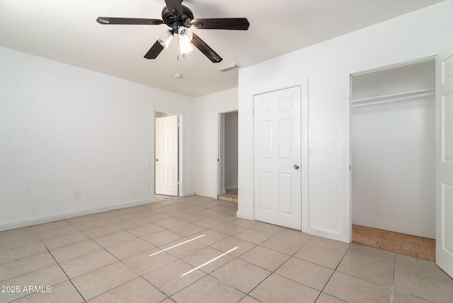 unfurnished bedroom featuring light tile patterned flooring and ceiling fan