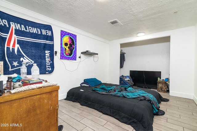 bedroom with a textured ceiling