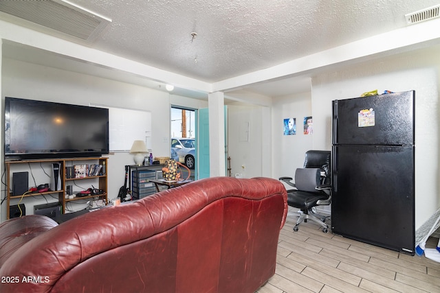 living room featuring a textured ceiling