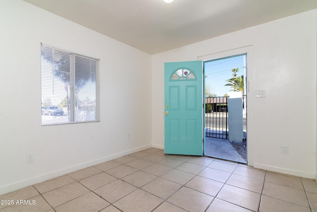 tiled foyer featuring a wealth of natural light