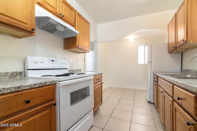 kitchen with sink, white electric range, and light tile patterned flooring