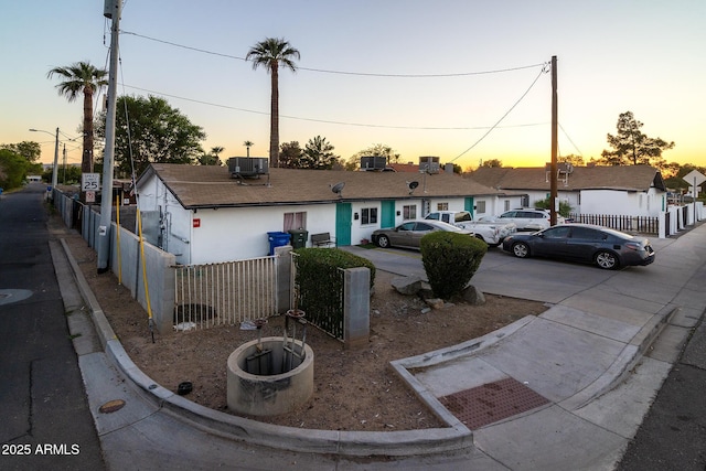 view of front of home featuring central air condition unit