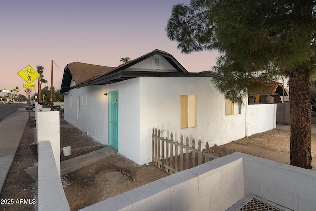 view of property exterior at dusk