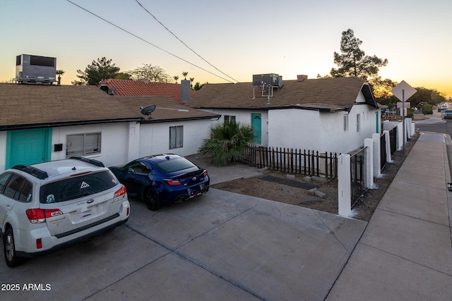 single story home featuring central air condition unit