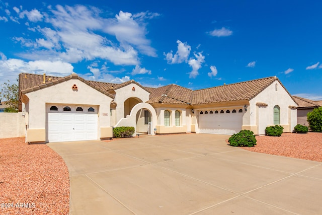 mediterranean / spanish-style house featuring a garage