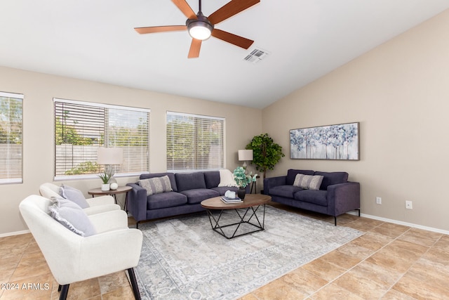 tiled living room with ceiling fan, vaulted ceiling, and a healthy amount of sunlight