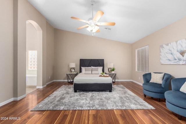 bedroom featuring ceiling fan, vaulted ceiling, and dark hardwood / wood-style floors